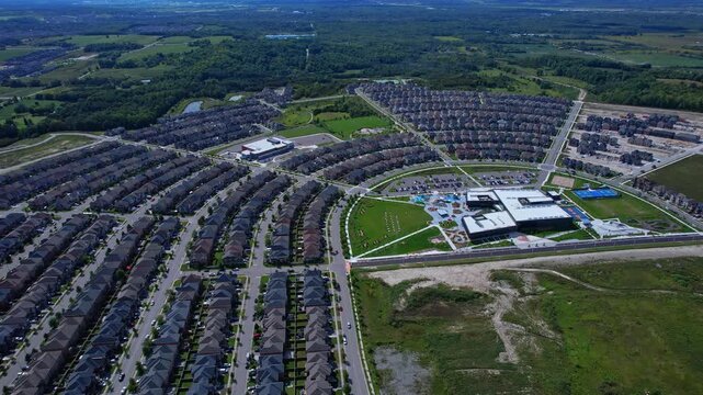 Real estate project construction site in America. Townhouses and Housing building development in North America. Homes in strong pattern replicate bee hive clusters look.