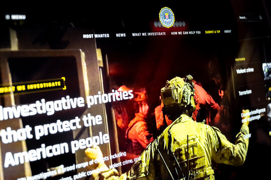 Fbi agent interacting with investigative priorities interface