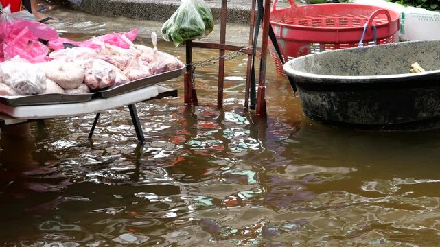 Bangkok Flood Market. Bangkok Flash floods caused by monsoon rains have turned all 50 districts of Bangkok into official disaster zones. Many people are going out shopping despite the flood. 