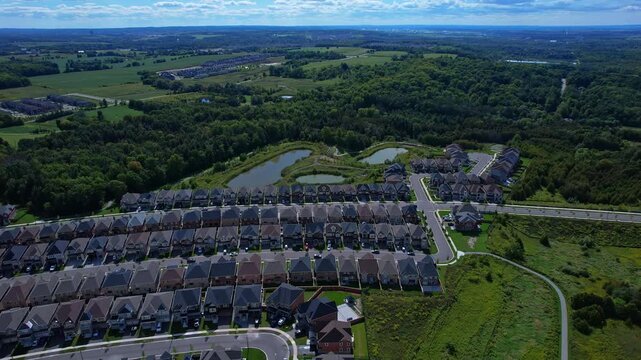 Real estate project construction site in America. Townhouses and Housing building development in North America. Homes in strong pattern replicate bee hive clusters look.
