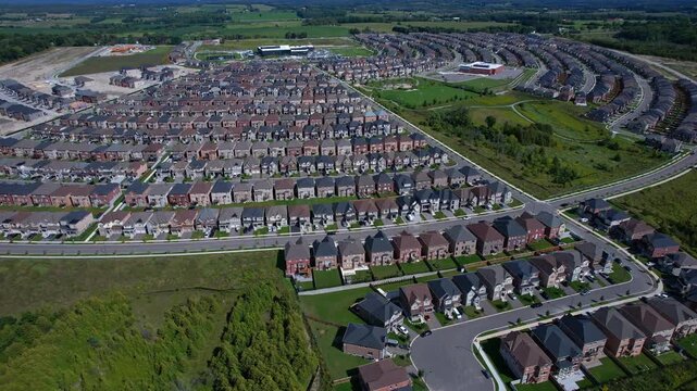 Real estate project construction site in America. Townhouses and Housing building development in North America. Homes in strong pattern replicate bee hive clusters look.