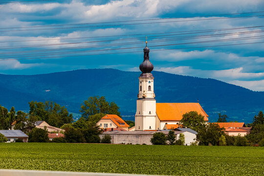 Church on a sunny summer day with the Bavarian forest in the background at Loh, Stephansposching, Danube, Deggendorf, Bavaria, Germany