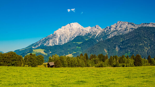 Alpine summer view with a crooked and lopsided wooden hut at Saalfelden am Steinernen Meer, Zell am See, Pinzgau, Saalachtal valley, Salzburg, Austria