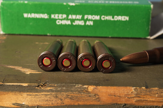 BALTIC STATES - SEPTEMBER 29, 2026: Macro close up of 7.62x39mm rifle cartridge headstamps showing factory code 71 and production years 93 and 86.