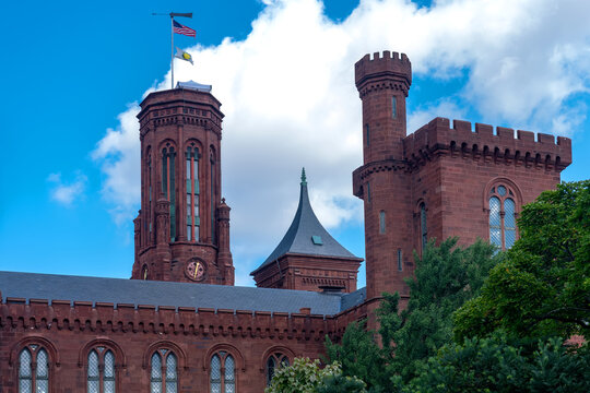 Historic red sandstone towers crown the Smithsonian Institution Building in Washington, DC.