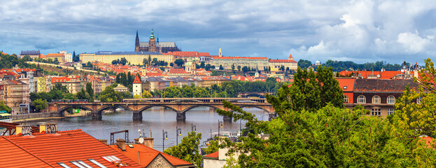 Summer cityscape, panorama, banner - view of the historical center of Prague with the castle complex Prague Castle and the Vltava River, Czech Republic, 27 June, 2022 © rustamank