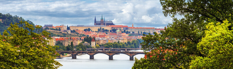 Summer cityscape, panorama, banner - view of the historical center of Prague with the castle complex Prague Castle and the Vltava River, Czech Republic, 27 June, 2022 © rustamank