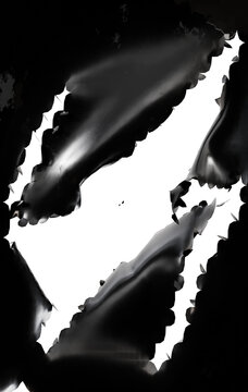 shredded and torn black leathery material, transparent background