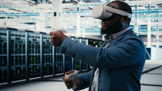 Employee using VR equipment for server machine maintenance