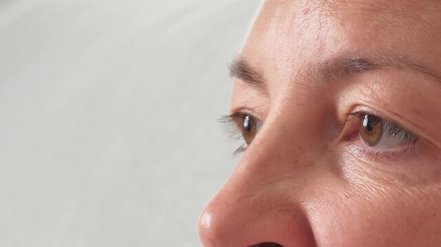 Close up of woman eyes and natural face looking forward