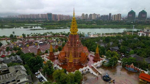Aerial View of Golden Temple in Vientiane, Laos with River and City Skyline