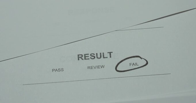 Close-up of a result assessment scale with Fail circled. Concept for failed result, unsuccessful evaluation, test failure, performance assessment and negative outcome.
