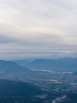 Misty Mountain Valley Overlook With River and Soft Pastel Sky Near Chilliwack, British Columbia