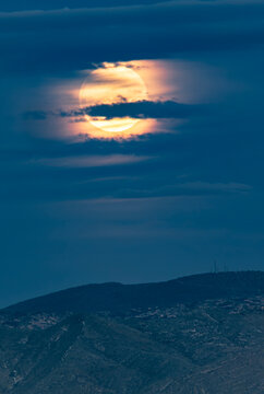 Full moon rising over the Mule Mountains near Bisbee Arizona
