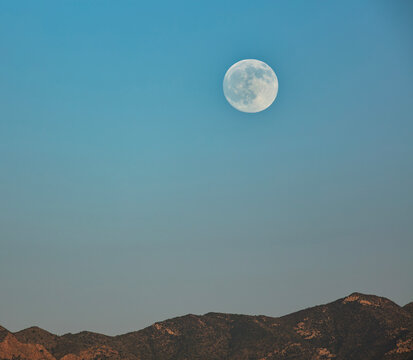 Full moon rising over southern Arizona's Mule Mountains