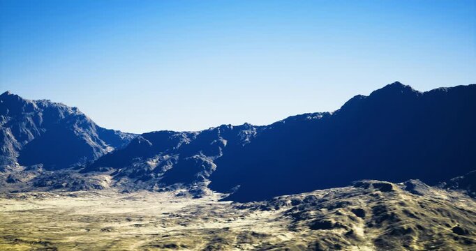 vibrant valley with bright blue sky and sculpted ridges, crisp contrast and vivid color ideal for active lifestyle, outdoor gear or promotional imagery