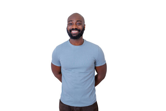 Black man with a beard and bald head smiling, standing with hands behind back, portraying happiness and confidence. Transparent background