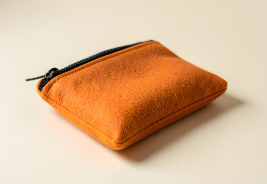 Pumpkin colored felt pencil pouch with a plain zip