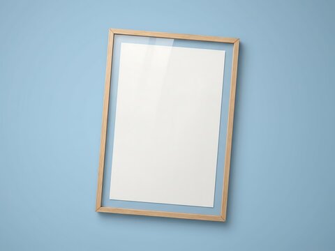Vertical wooden picture frame with an empty white blank canvas, ready for your artistic vision or important message, set against a calming blue wall background