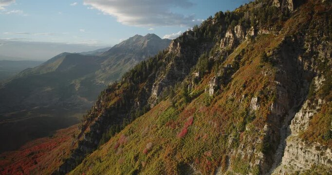 Sunset Glow On Beautiful Autumn Colored Rocky Mountain Side In Utah