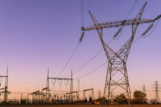 Overhead power lines and utility tower structures.