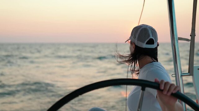 Yacht sailing on sea, woman captain controls marine vessel. Woman helm of yacht. Captain woman helm of ship sailing on ocean. Sea voyage. Captain helm of schooner. Make dream Sail towards adventure