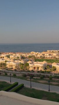 Scenic coastal resort at sunset with white villas and ocean views Egypt. Hurghada.Siva Golden Bay Makadi