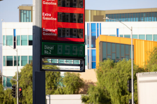 A Gas Station price board displays extremely high gasoline and diesel prices.