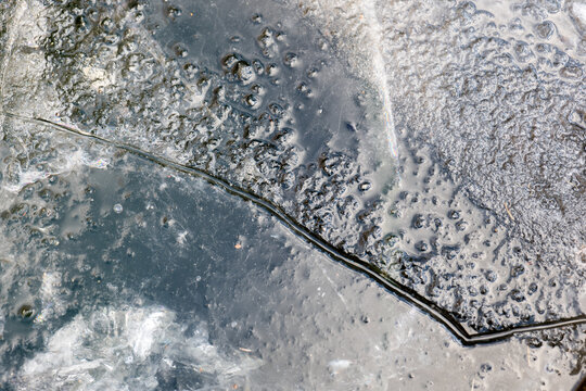  Winter weather wallpaper. Frost background. Frozen texture. Ice surface background. Texture of Cracked Frozen Lake Surface. 