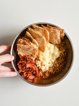 Instant noodle or Korean Ramen with cheese on top