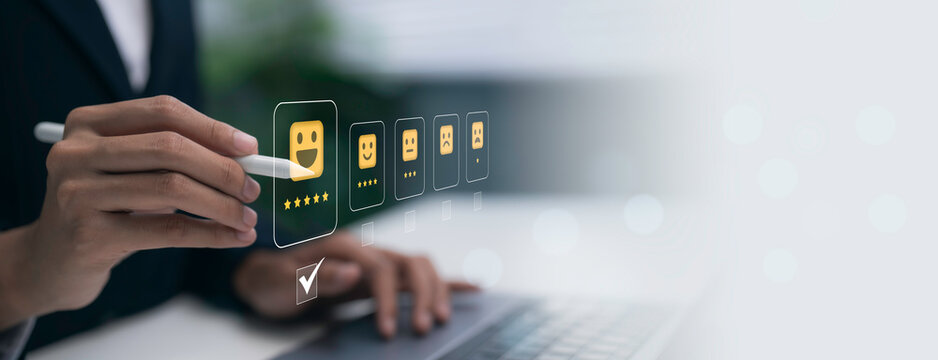Digital customer feedback concept showing professional selecting five star rating on laptop interface, representing online reviews, satisfaction, service quality and user experience analytics