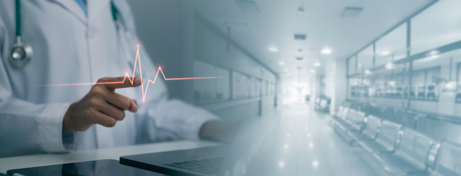 Digital healthcare concept showing medical professional interacting with glowing heart rate waveform in modern hospital corridor, representing patient monitoring, cardiac care and medical technology