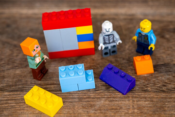 Obraz premium Detailed LEGO minifigures plastic blocks toys, Gaming culture and block building hobby, Creative Educational toy game merchandise children play, children's playroom, Childhood play and creativity
