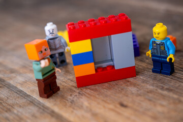 Obraz premium Detailed LEGO minifigures plastic blocks toys, Gaming culture and block building hobby, Creative Educational toy game merchandise children play, children's playroom, Childhood play and creativity