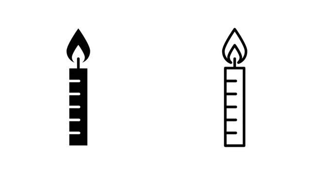 Two burning candles with measurement scale
