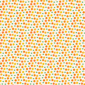 Seamless pattern of small orange and yellow flowers with green leaves