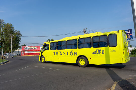 Fluorescent yellow Lipu personnel transport bus, by Mexico's Grupo Traxion. Jalisco, Mexico, July 20, 2026.