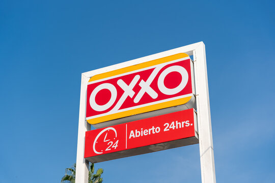 Oxxo advertising billboard, by Mexico's Femsa, in store parking lot. Jalisco, Mexico, July 20, 2026. FEMSA