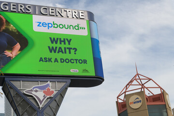 Fototapeta premium Rogers Centre Gardiner Pylon (or the Rogers Centre Pylon Marquee) with advertising for Zepbound (tirzepatide), Toronto