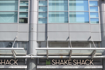 Obraz premium exterior building facade and sign of The Shake Shack, a quick service restaurant chain, located here at The Tenor, a shopping mall, located at 10 Dundas St E, Toronto