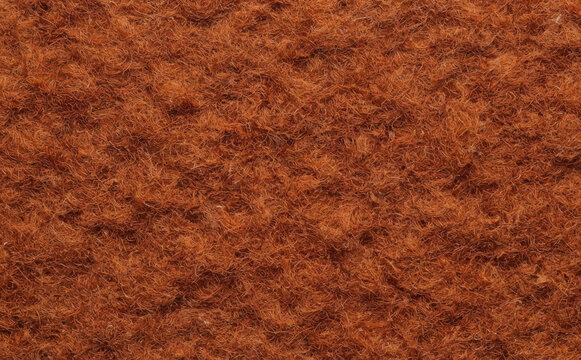 Rust brown felt texture background macro shot of woolen fabric material for crafting and design
