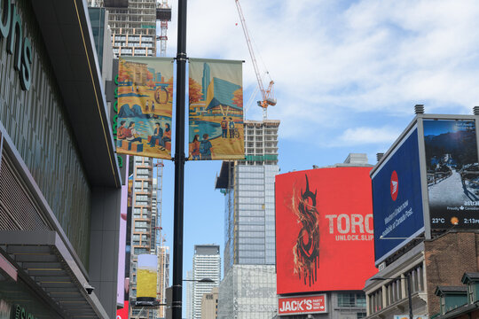 looking north on Yonge St (outside Simons, CF Toronto Eaton Centre location) to construction of condos and large-format digital billboards at Sankofa Square