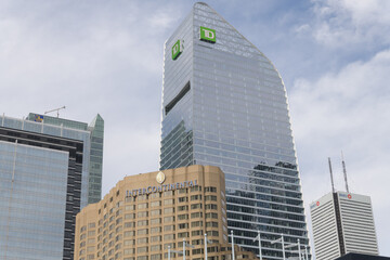 Obraz premium RBC Centre, Simcoe Place, Intercontinental hotel, and TD Terrace on a sky with feather smeary sorts of clouds, Toronto