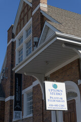Fototapeta premium sign outside Uptown Studio located at 527A Mount Pleasant Rd, and facade of Mount Pleasant Baptist Church, Toronto