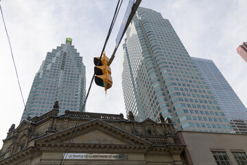 Fototapeta premium upward view of TD Place and Brookfield Place with Hockey Hall of Fame / Temple de la renommée du hockey located on the northwest corner of Front St W and Yonge St, Toronto