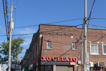 Fototapeta premium wide exterior view of XO Gelato, an ice cream shop, located at 647 Mount Pleasant Rd, Toronto