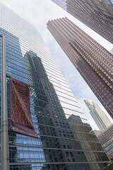 Fototapeta premium abstract upward view of Scotia Plaza and Bay Adelaide Centre with reflection of St Regis tower in Toronto