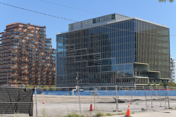 Fototapeta premium distant view of Aqualuna Condos, located at 155 Merchants' Wharf, and T3 Bayside, a corporate office located at 251 Queens Quay E, Toronto