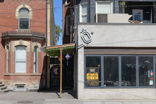 historic house and exterior of Dz&ocirc; Viet Eatery, a Vietnamese restaurant, located at 308 Dundas St W, Toronto