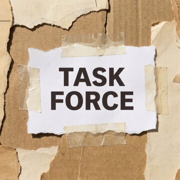 Task Force Text Handwritten on Torn Paper and Taped to Cardboard Teamwork Concept